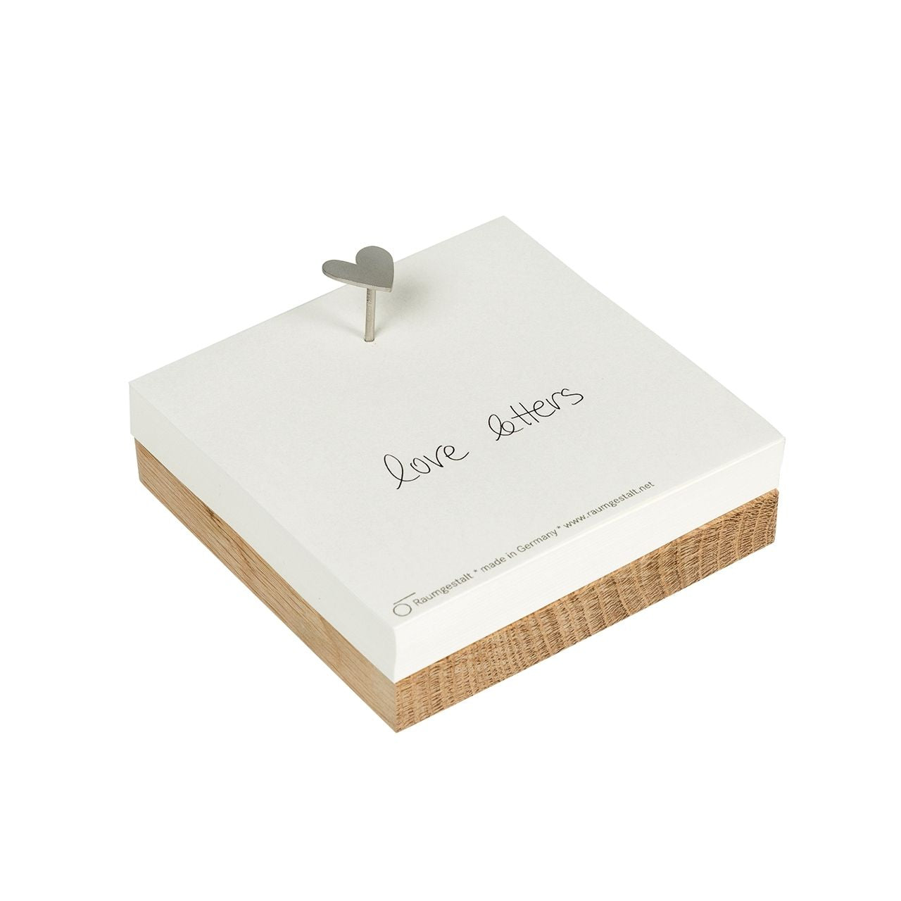 Merkzettel auf Eichenklotz „Love“